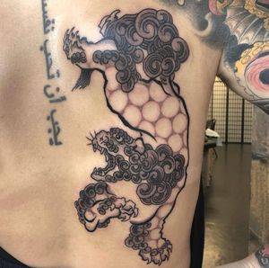 Foo dog tattoo made by Robert Johnson of the Bell Rose Tattoo in Daphne, Alabama.