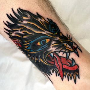 Get a fierce and timeless traditional wolf tattoo on your forearm by Alessandro Lanzafame.
