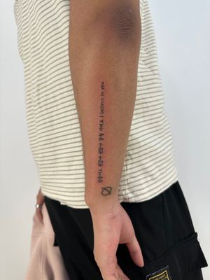 Get a meaningful quote tattooed in small lettering on your forearm by the talented artist Hansol Jung.