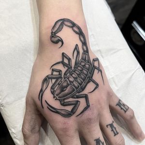 Fineline scorpion on hand