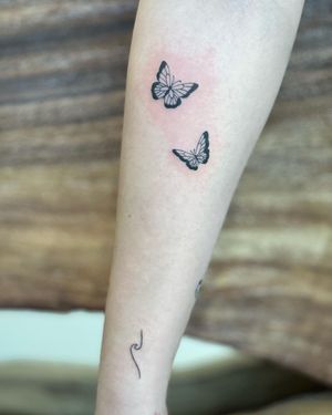 Elegant butterfly design by Hana Kaki, perfect for a delicate and timeless look on your forearm.