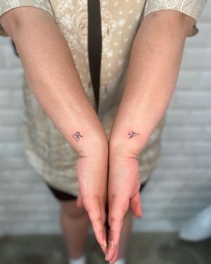 Get elegant small lettering tattooed on your forearm by the talented artist Hana Kaki. Perfect for a minimalist and chic look.