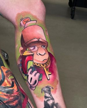 Get a new school style tattoo of a mischievous monkey holding a gun on your lower leg by tattoo artist Artemis.