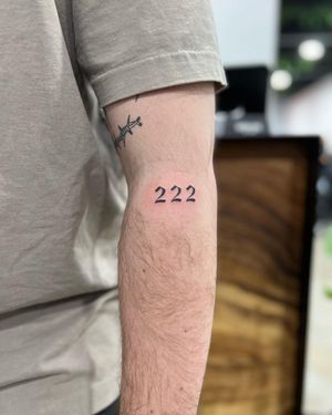 Get a sleek and stylish number tattoo on your forearm by the talented artist Hana Kaki. Perfect for a subtle yet meaningful design.