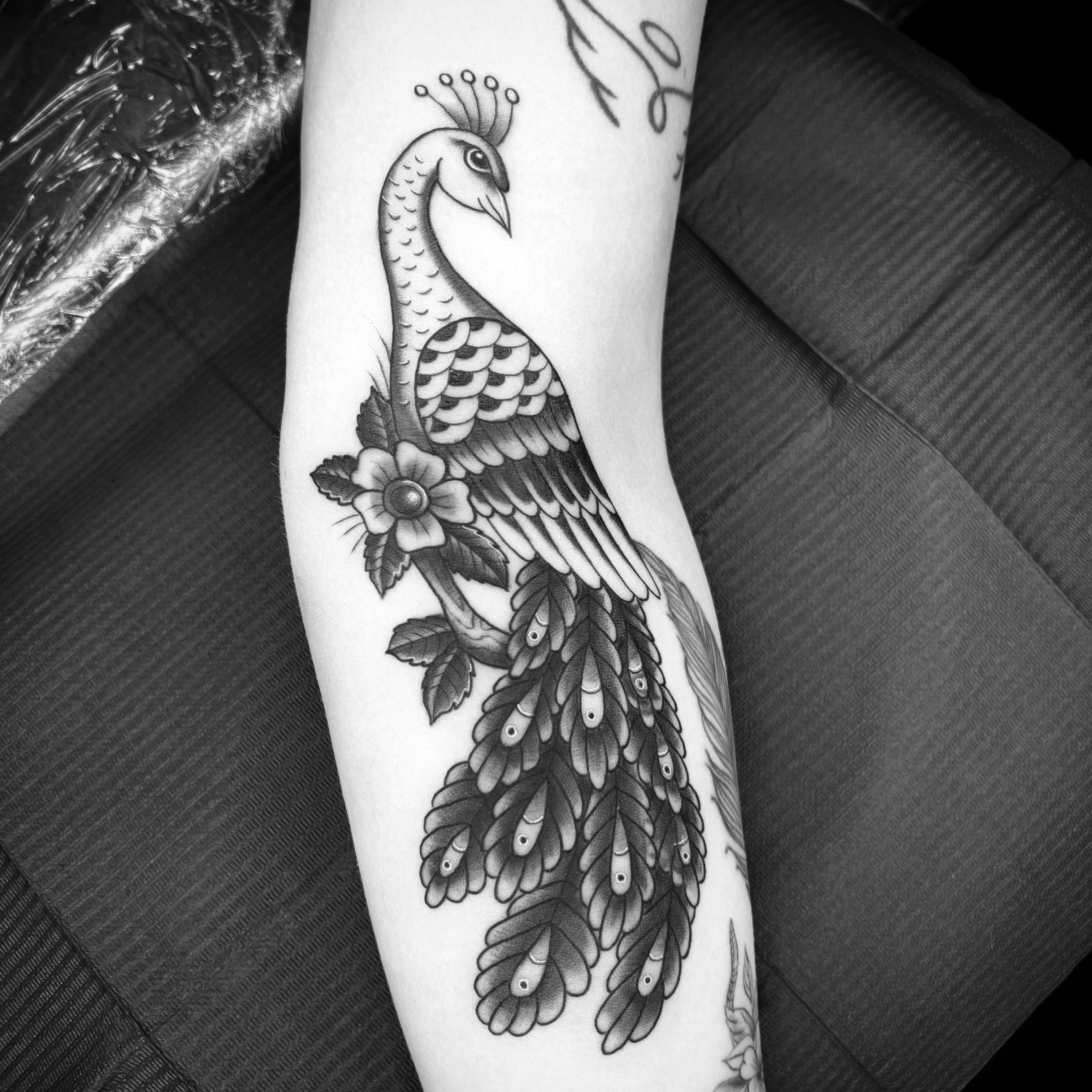 Graceful Peacock Arm Tattoo • Tattoodo