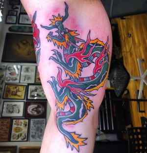 Experience the power and beauty of a Japanese traditional dragon tattoo, expertly crafted by the talented artist Carlos Zucato.