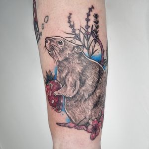 Elegant black and gray mouse design by Belle Tannahill, perfect for a subtle yet striking forearm tattoo.