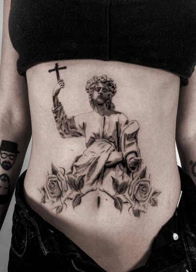 Stunning black and gray stomach tattoo by Jay Soze featuring a detailed cross and Jesus portrait.