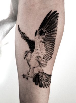 Get inked with a stunning black and gray micro realism eagle tattoo on your forearm by artist Jay Soze. Embrace the power and freedom of this majestic bird.