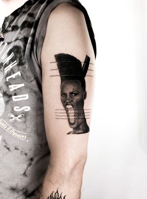 Experience exquisite black and gray micro realism with this stunning woman portrait tattoo on your upper arm by Jay Soze.