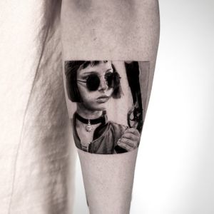 Exquisite black and gray arm tattoo by Jay Soze, featuring a lifelike portrait and stylish glasses.