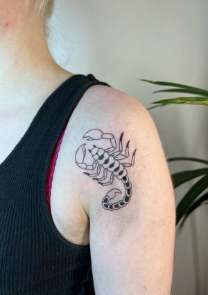 Get an intricately detailed scorpion tattoo on your shoulder by Kayleigh Cole for a stunning and realistic design.