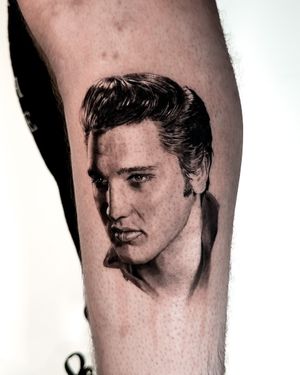 Capture the King's essence with this micro-realism black and gray portrait tattoo by the talented artist Jay Soze on your arm.