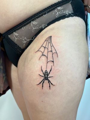 Ignorant style spider tattoo on upper leg by Kayleigh Cole, perfect for a bold and edgy look.