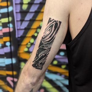 Adorn your upper arm with a mesmerizing blackwork pattern tattoo created by the talented artist George Antony.