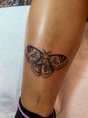 Embrace the enchanting beauty of a black and gray moth tattoo expertly designed by Kayleigh Cole.