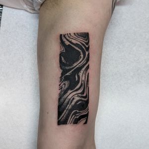 Elegant blackwork pattern tattoo on the upper arm by George Antony, showcasing stunning artistry and precision.