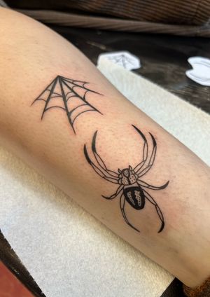 Get a stunning lower leg tattoo featuring a fine line, new school spider web design by the talented artist Kayleigh Cole. Ignite your style with this edgy and intricate piece!