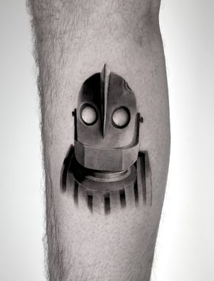 Get a sleek and detailed black and gray robot tattoo on your lower leg by the talented Jay Soze. Embrace your inner cyborg with this stunning micro realism design.