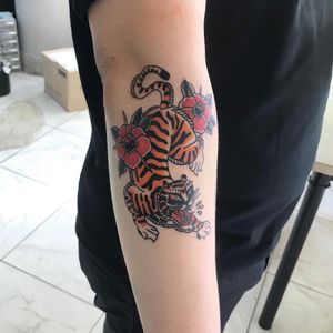 Get fierce with this traditional style tiger tattoo on your forearm, expertly done by Hansol Jung.