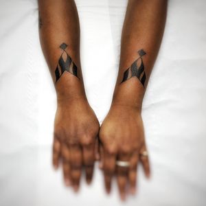Unique blackwork pattern and calligraphy design by artist Chun Lee, perfect for your forearm. Make a bold statement with this striking piece.