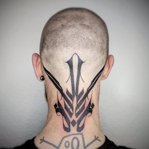 Express your boldness with this blackwork tribal neck tattoo by the talented Chun Lee. A stunning geometric pattern that commands attention.