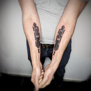 Get a bold and striking blackwork tribal pattern design by artist Chun Lee. Stand out with this unique forearm tattoo.