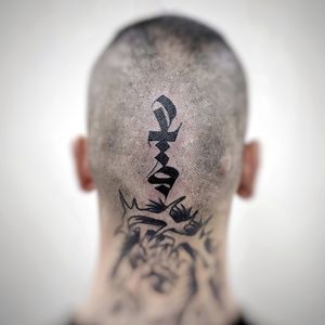 Explore the intricate details of this unique blackwork tribal pattern tattoo by tattoo artist Chun Lee. Perfectly placed on the side of the face, this tattoo is sure to make a bold statement.