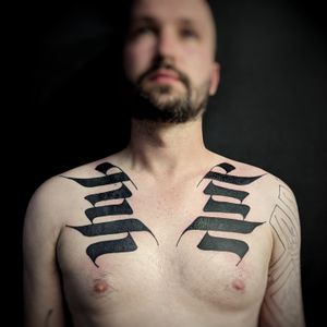 Get a striking blackwork pattern tattoo on your chest by the talented artist Chun Lee.