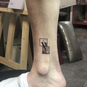 Sleek blackwork design of Titanic ship in fine line geometric style, by talented artist Hansol Jung. Perfect for ankle placement.