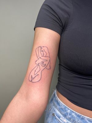 Beautiful minimalist forearm tattoo of a woman, expertly done by Kiky Flore