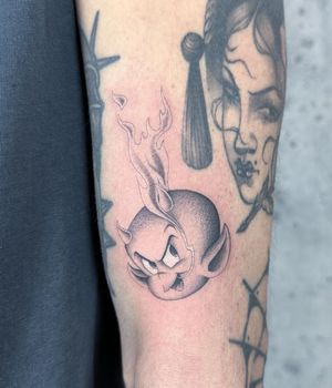 Get a devilish edge with this black and gray tattoo featuring flames. Created by Fresh Flower, this design is sure to make a bold statement.