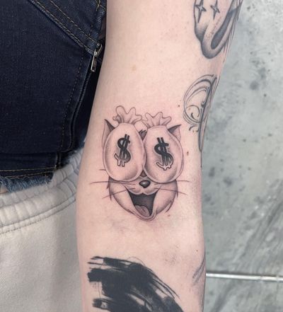 This black & gray tattoo by Fresh Flower features a sleek cat surrounded by money symbols, perfect for money lovers. Placement on the arm.