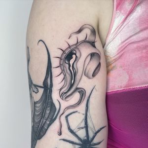 Experience exquisite black and gray fine line work by Fresh Flower on your upper arm, featuring a mesmerizing eye motif.
