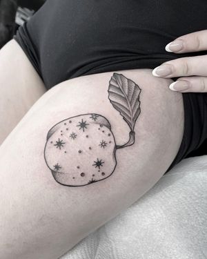 Beautiful upper leg tattoo of fruit in dotwork and fine line style by Federico Colantoni.