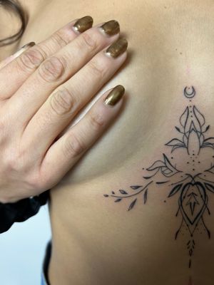Elegant and intricate fine line pattern tattoo inked under the boob by talented artist Kiky Flore.