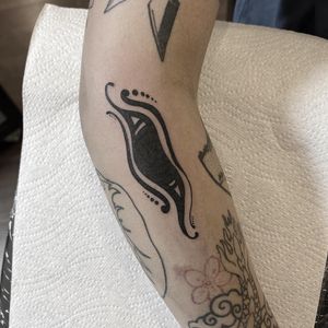 Immerse yourself in the mystique of ancient Egypt with this striking blackwork tattoo featuring a powerful Horus eye design by Federico Colantoni.