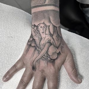 Beautiful black and gray angel tattoo on hand by Federico Colantoni. Symbolizing protection and guidance.