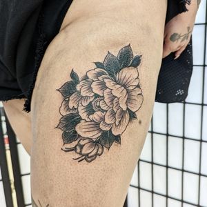 Experience the beauty of Japanese floral art with this intricate flower tattoo on your upper leg, expertly crafted by George Antony.
