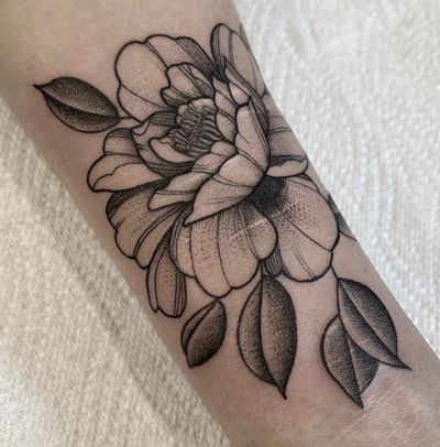 Adorn your arm with a stunning floral peony design by Federico Colantoni, a timeless and elegant choice for tattoo lovers.