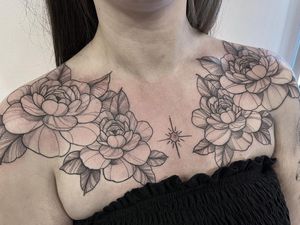 A beautiful floral chest tattoo featuring a stunning peony motif by Federico Colantoni. Perfect for those who love delicate and intricate designs.