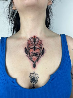 Get a stunning neo-traditional tattoo featuring a heart and eye motif on your chest by the talented artist Kiky Flore.