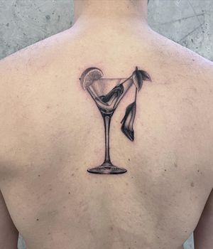 Experience refreshing micro-realism with a black and gray tattoo of a glass drink with a slice of lemon by the talented artist Fresh Flower.