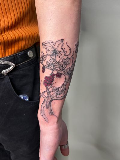 Captivating neo-traditional design by Kiky Flore featuring a tree and flower motif on the forearm.