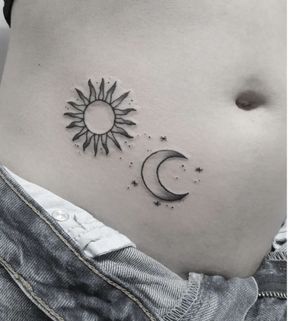 Celebrate the eternal balance of night and day with a stunning black and gray sun and moon tattoo by Elisa Thirteen.