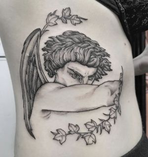 Beautiful black and gray tattoo featuring an angel and Lucifer, expertly done by Elisa Thirteen on the ribs. A unique and powerful design.
