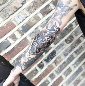 Adorn your forearm with a mesmerizing blackwork pattern tattoo expertly done by the talented artist George Antony.