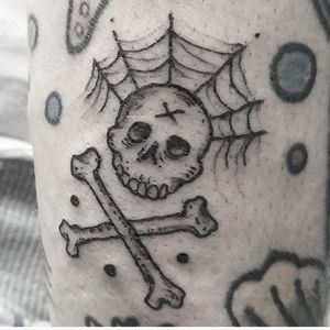Get inked with this haunting black and gray tattoo featuring a skull and spiderweb design by Elisa Thirteen.