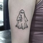 Capture the spirit world with this haunting black-and-gray ghost tattoo by Elisa Thirteen. Perfect for those seeking a touch of the supernatural.