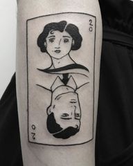 Capture love and luck with this exquisite black and gray fine line tattoo on your forearm by Elisa Thirteen.
